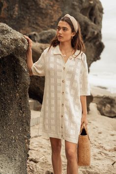 This Checkered Crochet Sweater Mini Dress features classic crochet knit detailing and an ivory hue, making it a timeless choice perfect for any season. Its relaxed fit bodice and oversized sleeves are accentuated by the button-down collar detail, allowing you to easily style it up or down. Crafted with 100% Cotton, this dress is sure to become a staple in your wardrobe. Model's wearing size small, and her height is 5'8" White Open Knit Dress For Day Out, White Crochet Dress For Fall, Casual White Crochet Dress With Open Knit, White Crochet Dress With Open Knit For Day Out, Casual Beige Crochet Dress With Pointelle Knit, Casual Crochet Knit Dress For Day Out, Casual Knit Crochet Dress For Day Out, Casual Pointelle Knit Dress For Day Out, Casual Long Sleeve Beige Crochet Dress