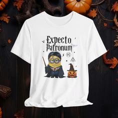 👉 If you are wanting this design on a different type of shirt(V-neck or Comfor Colors 1717)please send a message! Minions Potter Costume Halloween Shirt,Halloween Minions Shirt, Halloween Potter Shirt,Minions Halloween Shirt,Harry Halloween Tee,HP Gift,Bella Canvas Tee, Unisex Bella Canvas Shirt 👕FEATURES: 🎃Sizes run true to size.* Order a size or two bigger for an oversized look. 🎃Tear away the label for added comfort. 🎃Solid Color Materials: 100% Airlume Combed and Ringspun Cotton 🎃Heather Color Materials: 52% Airlume combed and Ringspun cotton, 48% polyester 👉Care Instructions: Machine wash cold inside out, tumble dry low or hang to dry for best results. Avoid ironing directly on the print to preserve its  colors. 🚫 Returns and Exchanges: Due to the personalized nature of our pr Halloween Minions, Minions Shirt, Minions Halloween, Minion Shirts, Minion Halloween, Bella Canvas Tees, Halloween Tees, Costume Halloween, Halloween Shirt