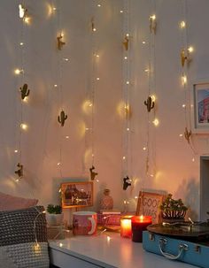 a room with some lights hanging from the ceiling and decorations on the wall above it