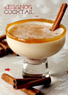 an eggnog cocktail is garnished with cinnamon