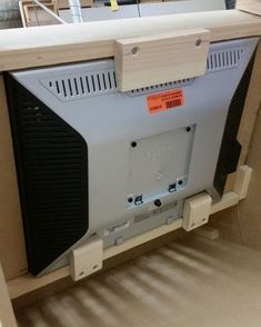 an old computer monitor sitting on top of a shelf