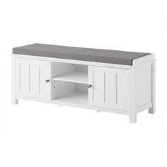 a white entertainment center with gray top