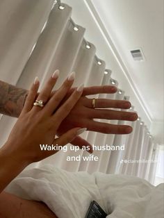 two hands reaching out to each other with the caption waking up as husband and wife