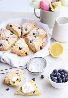 blueberry scones and lemon slices on a table