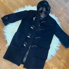 Great Used Condition Navy Blue Duffle Coat Burberry’s No Size Marked But Fits A Medium Wooden Toggle Closure Smoke Free | Pet Friendly Home I Ship Within 24 Hours M-F Willing To Accept Reasonable Offers All Items Are Pre-Owned, And Sold As-Is I Try To Disclose All Flaws, But Please Be Sure To Look Over All Listing Photos Before Purchasing Thank You! New To Poshmark?? Use Code “Thelittlelilly” At Sign Up To Receive $10 Off!! Preppy Blue Outerwear For Fall, Preppy Fitted Winter Outerwear, Fitted Preppy Outerwear For Winter, Navy Fitted Preppy Outerwear, Fitted Preppy Winter Outerwear, Burberry Winter Coat, Burberry Wool Coat Women, Blue Duffle Coat, Burberry Duffle Coat