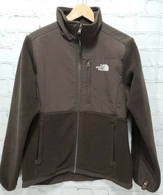 The North Face Women's Denali Fleece Jacket Brown Size M Medium   Size: Medium   Actual Measurements:                                   - Armpit to Armpit: 21.5”                                                   - Neck to Front Hem: 22”   - Back Neck to Bottom Hem: 27”   - Neck Hem to Cuff Hem: 30”   - Shoulder Hem to Cuff Hem: 25“   Color: Brown Features:Bottom of Form ·       Full zip front ·       2 Zip close Front pockets and 1 zip close chest pocket ·       Can be used as a liner jacket Con The North Face Fleece Jacket With Pockets For Streetwear, The North Face Fleece Jacket With Pockets, The North Face Sports Fleece Jacket For Winter, The North Face Winter Sports Fleece Jacket, Brown Fleece Jacket With Fleece Lining For Streetwear, Functional Fleece Jacket By The North Face, Functional Long Sleeve Fleece Jacket By The North Face, The North Face Fleece Jacket With Fleece Lining, The North Face Fleece Jacket With Long Sleeves