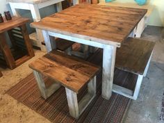 a kitchen table with two benches next to it