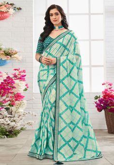 Chinon printed Saree in Sea green colour 104  Desc:  Color : Sea Green Fabric : Chinon Work : Printed   Embroidery   Lace Border Wash Care : Dry clean Sleeve Style : Half Sleeve Long Sleeves : Done only in Custom Stitch Sleeves Lining : Done only in Custom Stitch Bust Size : 32 to 42 Inches Occasion : Kitty Party   Mehendi   Sangeet   Reception   Gudi Padwa   Party Wear. With Express Free Shipping and Custom Stitching, Buy Indian Party wedding wear Bridal Sarees Chinon printed Saree in Sea green Spring Green Dupatta With Zari Work, Green Georgette Blouse Piece For Festivals, Green Dupatta With Printed Motifs For Festive Occasion, Festive Green Dupatta With Printed Motifs, Bollywood Style Green Saree With Printed Motifs, Unstitched Green Georgette Blouse Piece, Unstitched Green Georgette Saree, Fitted Green Saree With Printed Border, Green Semi-stitched Dupatta For Spring