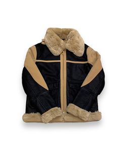 A heavy shearling coat with a collar that can fold down or turn into a turtleneck feel. The heavy material with the fur inside is sure to block out any cold and insulate the warmth inside. It is black with coffee accents and is a bit wide on the cut. Toddler Accessories, Shearling Coat, Black Coffee, Winter Sale, Nike Jordan, Outerwear Women, Jordan Shoes, Short Pants, Bomber Jacket