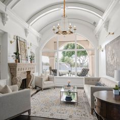 a living room filled with furniture and a fire place