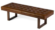 a leather bench sitting on top of a metal frame