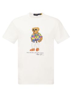 This cotton T-shirt features the iconic mascot, the world's most stylish teddy bear, printed on the front. - Classic-Fit: loose fit on chest, waist and sleeves, with lowered armholes, closer to the elbow - Crew-neck - Short sleeves - Polo Bear and the words "Polo Bear by Ralph Lauren" and "Ralph Lauren" printed in the centre front DESIGNER ID: 710854497 032Composition: 100% Cotton | Polo Ralph Lauren Men's Polo Bear Jersey Classic-fit T-shirt in White | SS24 Polo Bear By Ralph Lauren, Ralph Lauren Polo Bear, Classic American Style, Ralph Lauren Logo, Polo Bear, Bear Print, Cotton Polo, Ralph Lauren Polo, T-shirt Polos