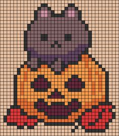 a cross stitch pattern with a cat sitting on top of a pumpkin