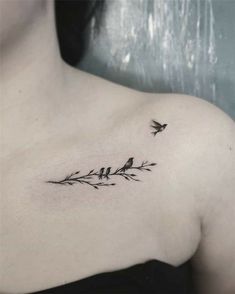 a woman's chest with birds on it