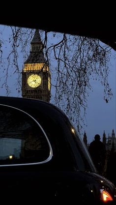 the big ben clock tower towering over the city of london, england at night time