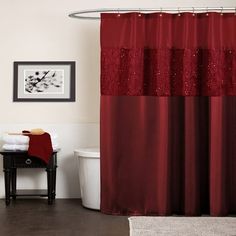 a red shower curtain in a white bathroom