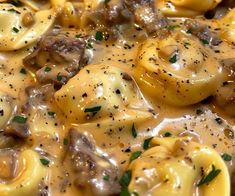 pasta with mushrooms and sauce in a skillet