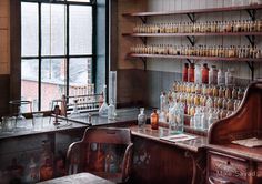 an old fashioned laboratory with lots of bottles