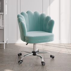 a blue office chair sitting on top of a wooden floor next to a white wall