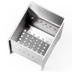 a stainless steel sink with holes in the bottom and side panels on each side, against a white background