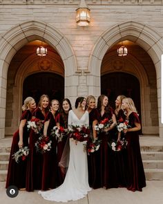 a group of women standing next to each other in front of a building with red and white bouquets