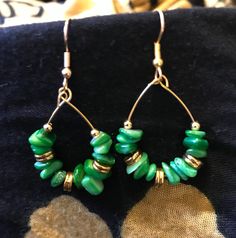 Handmade with green irregular gemstone chips accented with gold pieces. Hypoallergenic. Elegant Green Natural Stone Hoop Earrings, Green Teardrop Hoop Earrings For May Birthstone, Nickel-free Green Teardrop Hoop Earrings, Green Teardrop Nickel-free Hoop Earrings, Green Teardrop Nickel Free Hoop Earrings, Green Small Hoop Metal Earrings, Green Hoop Earrings With Natural Stones For Gift, Green Gemstone Dangle Hoop Earrings, Elegant Green Wire Wrapped Hoop Earrings