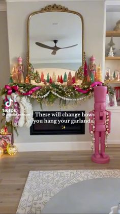 a living room decorated for christmas with pink decorations on the mantle and fireplace mantel