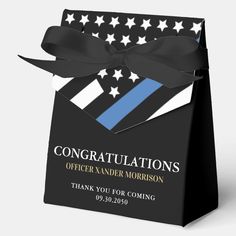 a black and blue gift bag with an american flag on the front, and stars in the back