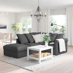 a living room filled with furniture and a white coffee table