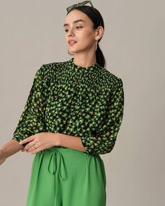 Details: 
- Model is 5 8½, wearing a Size S Model's measurements: Bust - 31.9'', Waist - 24'', Hips - 35.4'' - Mock Neck - Floral print - Puff Sleeve Blouse - Ruched - Loose Fabric: It is made of Polyester and Elastane. Polyester is a man-made fiber that feels soft, looks lustrous, and dries fast. It's also durable, with its good resistance to wrinkles, stains, and sunlight. Elastane has good acid and alkali resistance, sweat resistance, seawater resistance, dry cleaning resistance, and abrasion Green Puff Sleeve Smocked Top, Green Summer Blouse With Smocked Cuffs, Summer Green Blouse With Smocked Cuffs, Green Long Sleeve Smocked Top With Smocked Cuffs, Green Long Sleeve Smocked Top, Fitted Green Blouse With Gathered Sleeves, Casual Green Tops With Gathered Sleeves, Spring Workwear Top With Smocked Bodice, Green Smocked Top With Smocked Cuffs For Fall