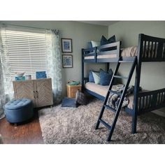 a bedroom with bunk beds and rugs on the floor