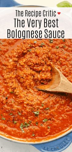 a wooden spoon is in a large pot of bologine sauce with the words, the recipe critic the very best bologinese sauce