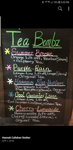 the menu for tea bombz is written on a blackboard