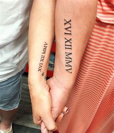 two people holding hands with tattoos on their arms and the words xxvix, xxiv