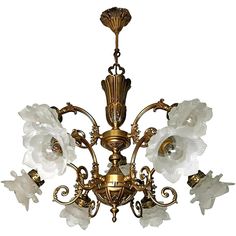 an antique chandelier with white flowers on it