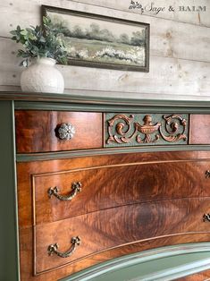 an antique dresser with ornate carvings and knobs on the drawers is shown in this room