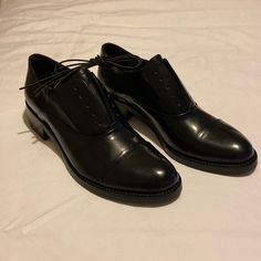 Size 9 (Eu 39.5) Brand New. Never Worn. Black Patent. 1.5” Heel. Cap Toe. Can Be Worn With Or Without Laces (Included). No Box. No Scuffs Or Marks. Black Cap Toe Lace-up Shoes For Office, Classic Black Low Heel Lace-up Shoes, Black Cap Toe Loafers, Black Cap Toe Loafers For Office, Black Cap Toe Office Loafers, Elegant Black Lace-up Shoes With Flat Heel, Black Low Heel Oxfords For Formal Occasions, Black Oxfords With Leather Sole And Low Heel, Black Cap Toe Lace-up Office Shoes