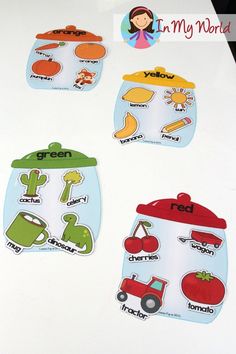 four stickers with pictures of food and words on them, sitting on top of a table