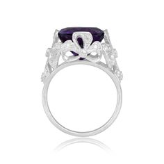 A bold gemstone ring featuring a 6.00 carat cushion-cut amethyst center stone that is set in prongs. Surrounding the amethyst are single-cut diamonds that are micro-pave set in a platinum bow motif. The total weight of the diamonds is approximately 0.62 carats. This ring is handcrafted in platinum.
The measurements of the center stone are approximately 11.84mm x 11.13mm x 8.36mm.
The current size of this ring is 7 and can be resized at no extra cost.
Ready to Make It Yours? Contact us to reserve Luxury Cushion Cut Amethyst Ring With Prong Setting, 3 Carat Ring, Vintage Diamond Earrings, Asscher Cut Ring, Kunzite Ring, Fancy Diamond Ring, 5 Carat Ring, Colored Diamond Rings, Designer Diamond Jewellery