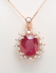 7.35 Carat Natural Red Ruby and Diamonds Women Chain and Pendant Made in 14K Solid Rose Gold Suggested Retail Value $5,999.00 Pendant Measurements are - 26.50 X 19.12 mm Ruby Measurements Approx are - 12.00 x 10.00 mm Total Ruby Weight is - 6.48 Carat Total Diamond Carat Weight is - .87 Carat Diamond Clarity: SI1-SI2 Diamond Color: H-I Chains available in - 16 INCH TOTAL ITEM WEIGHT IS 6.1 gram Disclaimer: All colors, measurements and weights are approximate and may vary slightly from the listed dimensions or as seen in the image'' Red Pendant Jewelry With Brilliant Cut, Elegant Red Diamond-cut Necklace, Luxury Ruby Pendant Jewelry, Pear-shaped Ruby Gemstone Necklace, Luxury Red Multi-stone Necklaces, Rose Gold Pendant, Personalized Pendant, Natural Red, Diamond Clarity