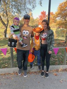 a man, woman and two children are posing for a photo