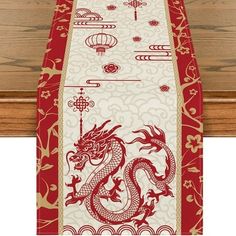 a red and white table runner with a dragon on it