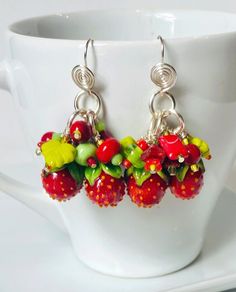 These Bowl Full of ... Strawberries earrings are whimsical chic! They feature artisan, handmade glass berries, glass flowers, leaves and other glass lovelies they are paired with silver/copper wire and ear wires. The colorful fun of these statement earrings make them a one of a kind find. Playful Jewelry With Fruit Design For Gift, Playful Fruit Design Jewelry For Gifts, Whimsical Czech Glass Jewelry Set With Earrings, Playful Handmade Dangle Jewelry, Whimsical Multicolor Wire Wrapped Jewelry, Multicolor Fruit Design Earrings For Gift, Whimsical Czech Glass Jewelry With Ear Wire, Red Whimsical Nickel-free Earrings, Whimsical Red Nickel-free Earrings