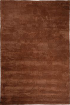 a brown area rug with an abstract design