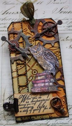 an altered book with a clock and owl on it