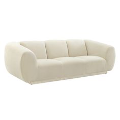 a white couch sitting on top of a white floor