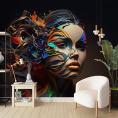 a woman's face painted with multicolored paint on a wall next to a white chair