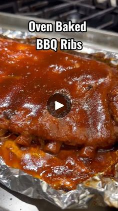 oven baked bbq ribs on tin foil with text overlay