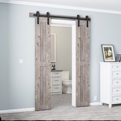 an open sliding door in a bedroom with white furniture