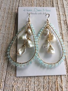 "Stunning 14 kt gold fill wrapped teardrop earrings, hand wrapped with aqua chalcedony micro faceted beads. 4 lustrous white freshwater Keshi pearls dangle in the middle on gold fill chain. Free domestic shipping Measures 2 5/8\" long from top of ear wire. 1 3/8\" wide." Keshi Pearl Earrings, Mother Of Pearl Earrings, Aqua Chalcedony, Keshi Pearls, Gold Filled Jewelry, Gorgeous Earrings, Gold Filled Chain, Leaf Earrings, Faceted Bead